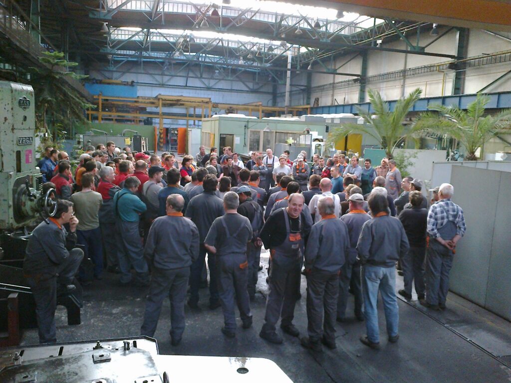 Stefan Ceman speaking with a production team during a business transformation in 2012